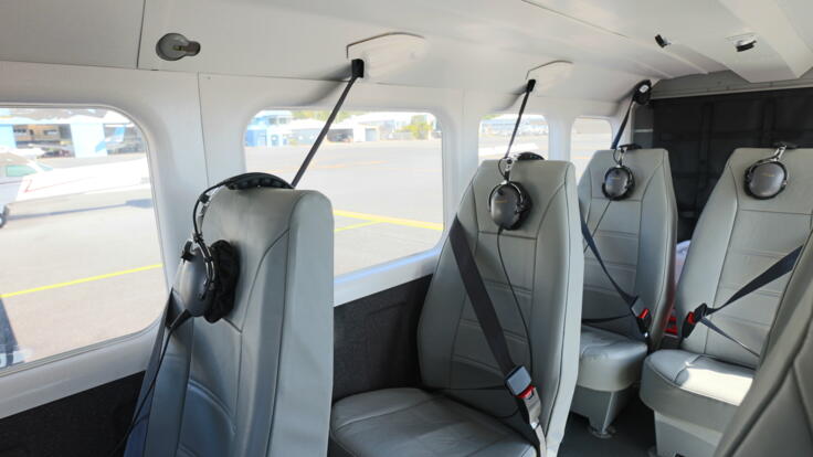Interior view of fixed wing aircraft and comfortable leather seating on our Cairns scenic flight