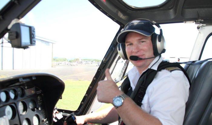 Friendly helicopter pilot ready to take you on a scenic flight from Port Douglas and Cairns 