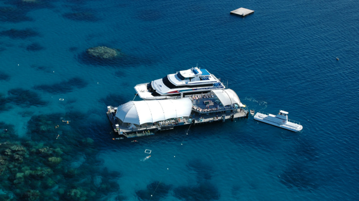 Cairns Combo Tours - Aerial views of the Great Barrier Reef tour platform below