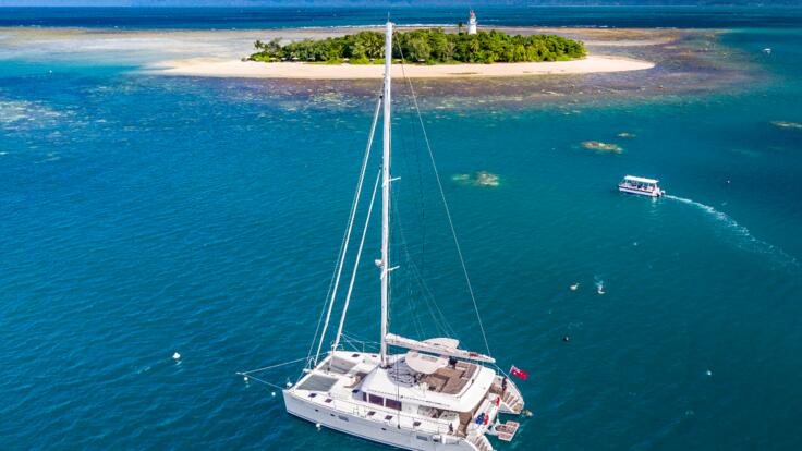 Sunset Cruise Port Douglas - Aerial view of private charter yacht in Port Douglas on the Great Barrier Reef Australia  