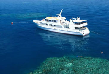 Cairns Dive Tours - Aerial view of liveaboard dive boat on the Coral Sea 