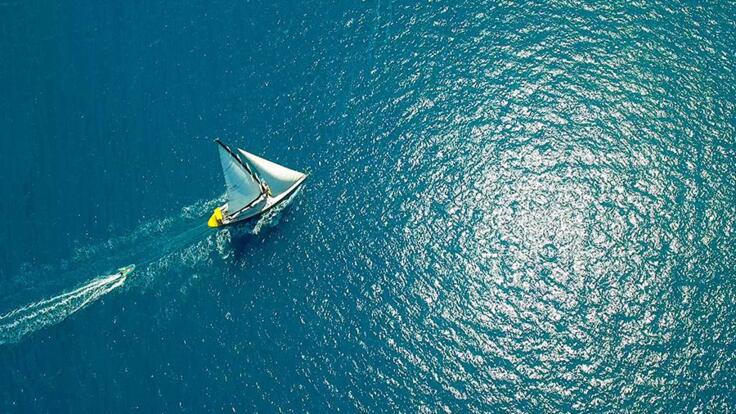 Barrier Reef Australia: Drone image of Whitsunday dive boat under sail