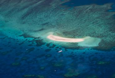 Cairns scenic flight over a Sandy Cay on the Great Barrier Reef in Australia 