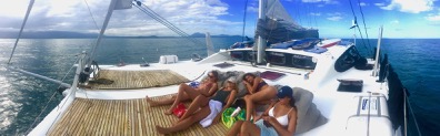 Relax on the forward deck of your private charter yacht on the Great Barrier Reef