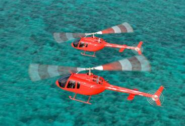 Two helicopters on scenic flights on the Great Barrier Reef in Australia