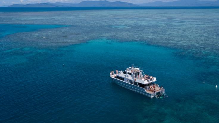 Aerial view of our boat at the Wonder Wall on the Great Barrier Reef in Australia 