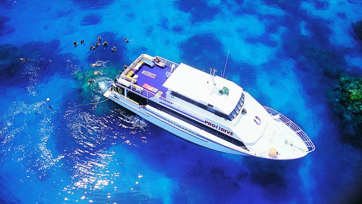 Dive Trips Cairns - Aerial view of our live-aboard dive and snorkel boat on the Great Barrier Reef 